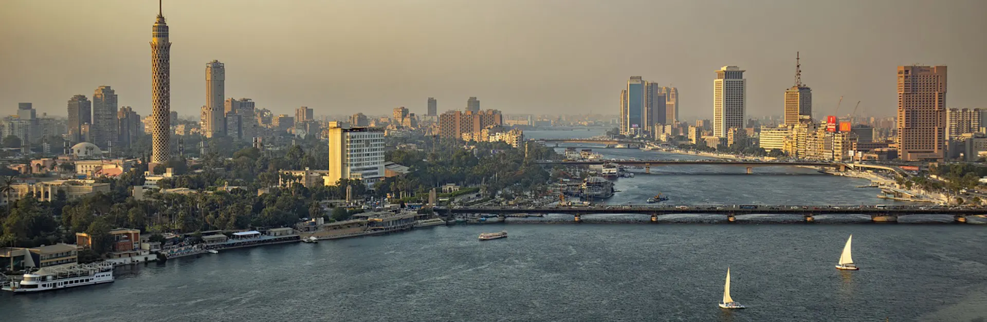 Business professionals overlooking a modern city skyline, representing commercial growth, investment relationships, and Egypt business expansion.